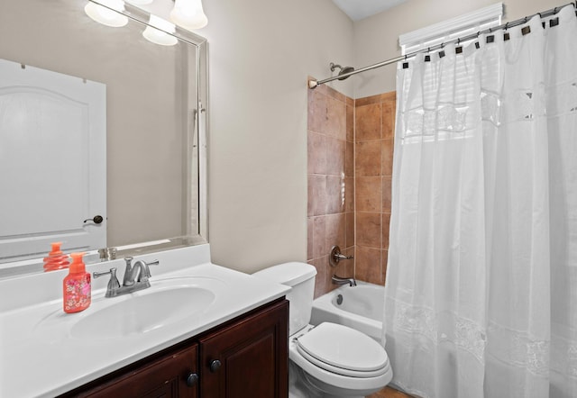 full bathroom with shower / tub combo with curtain, vanity, and toilet