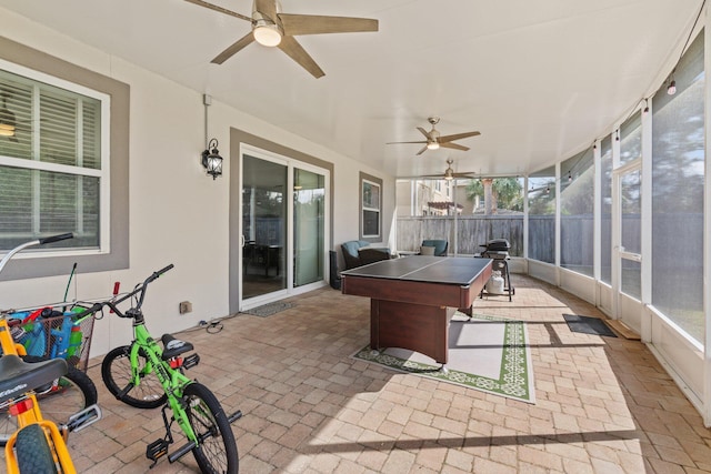 sunroom / solarium with ceiling fan