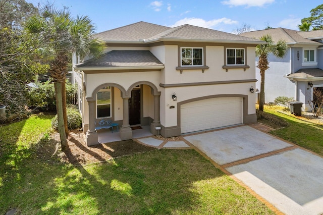 view of front of house featuring a garage, a porch, and a front lawn