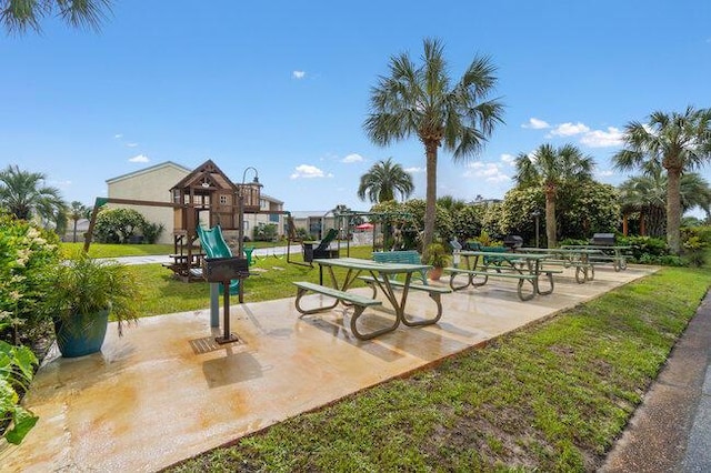 view of community with playground community and a yard