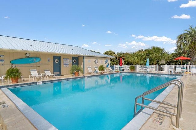 pool featuring a patio and fence