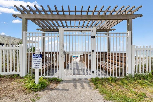 exterior space featuring fence and a pergola