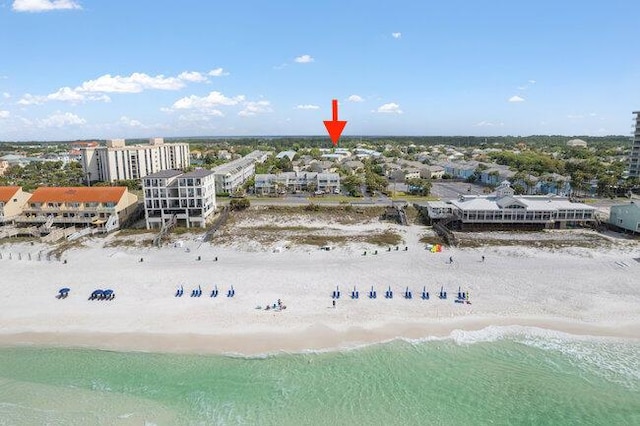 drone / aerial view with a water view and a view of the beach