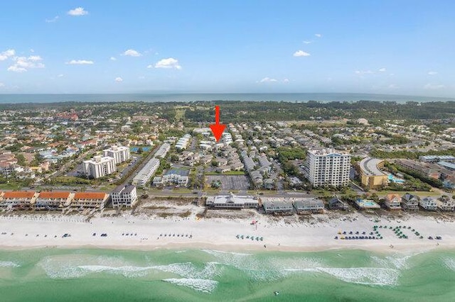 birds eye view of property with a view of city, a beach view, and a water view