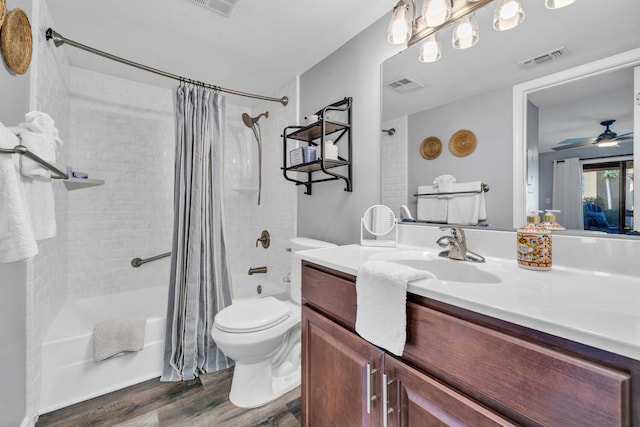 full bath featuring visible vents, toilet, shower / tub combo, vanity, and wood finished floors