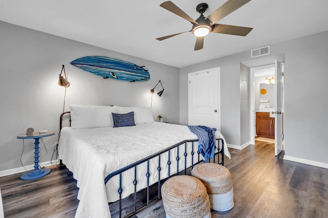 bedroom with a ceiling fan, wood finished floors, visible vents, and baseboards