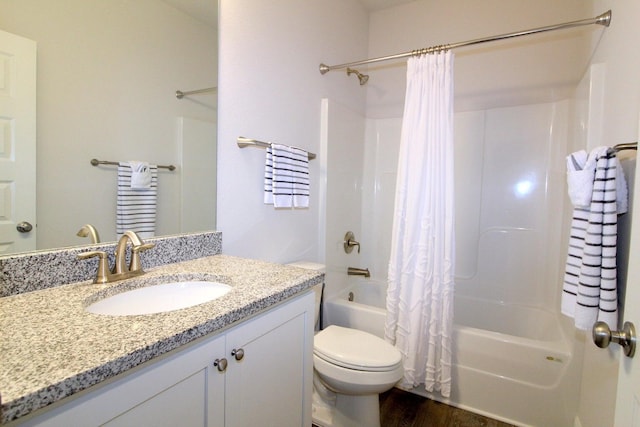 full bathroom featuring vanity, toilet, hardwood / wood-style flooring, and shower / bath combo