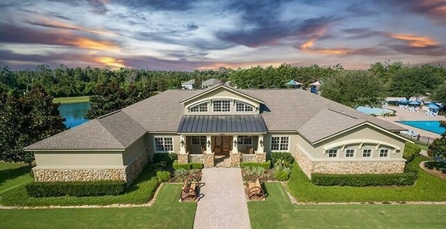 craftsman house with a yard