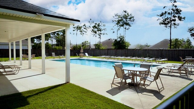 view of swimming pool featuring a patio area