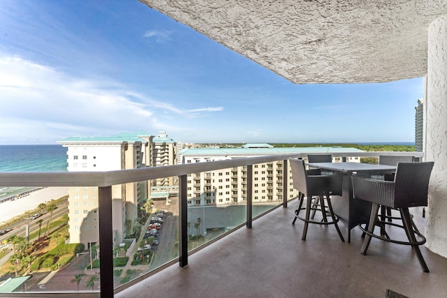 balcony featuring a view of city and a water view