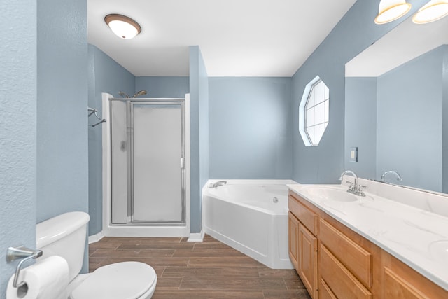 full bathroom featuring hardwood / wood-style floors, vanity, toilet, and plus walk in shower