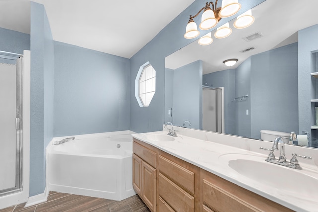 full bathroom featuring toilet, independent shower and bath, vanity, and hardwood / wood-style floors