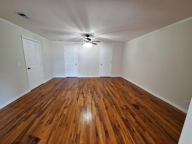 unfurnished bedroom featuring ceiling fan, dark hardwood / wood-style flooring, and ornamental molding