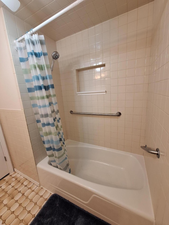 bathroom featuring shower / tub combo and tile patterned floors