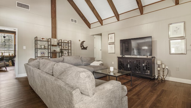 living area with beam ceiling, wood finished floors, and visible vents