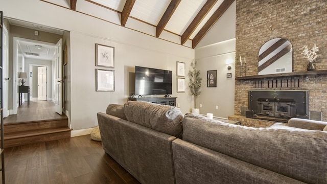 living room with baseboards, visible vents, dark wood-style flooring, high vaulted ceiling, and beam ceiling