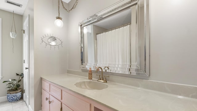 full bathroom featuring tile patterned flooring, vanity, and visible vents