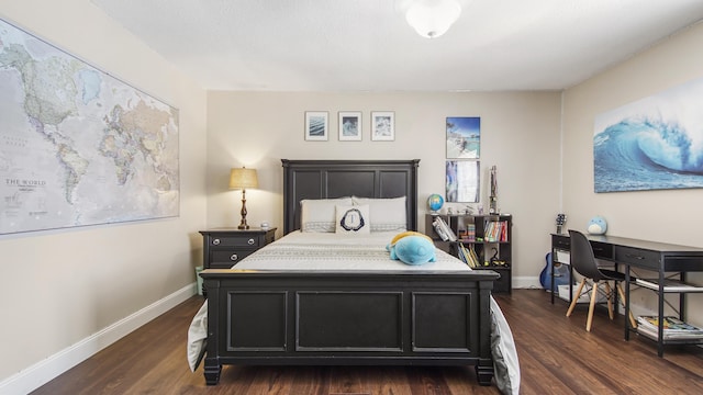 bedroom with baseboards and dark wood-style flooring