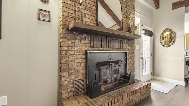 interior details featuring baseboards and wood finished floors