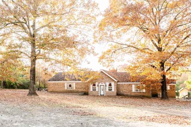 view of front of home featuring brick siding