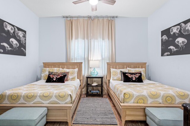 bedroom with wood-type flooring and ceiling fan