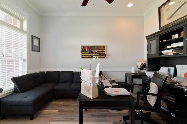 office area with crown molding, dark wood-type flooring, plenty of natural light, and ceiling fan