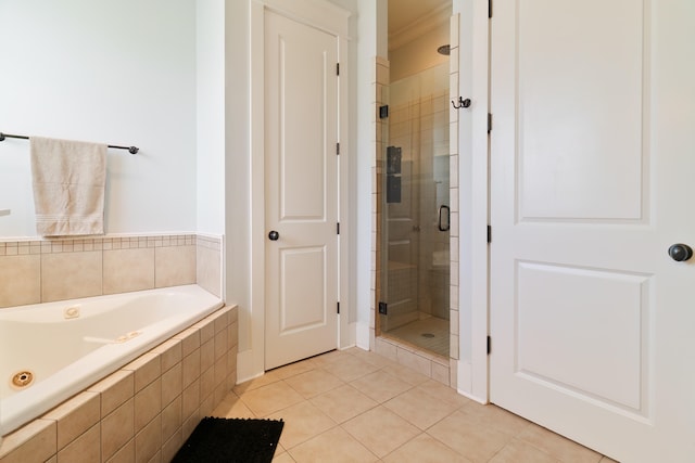 bathroom featuring independent shower and bath and tile patterned floors