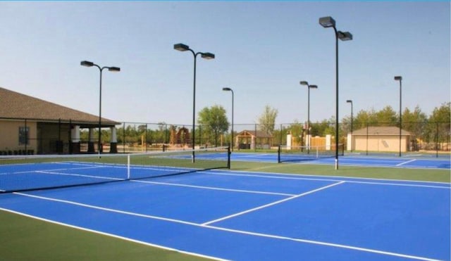 view of sport court with basketball hoop