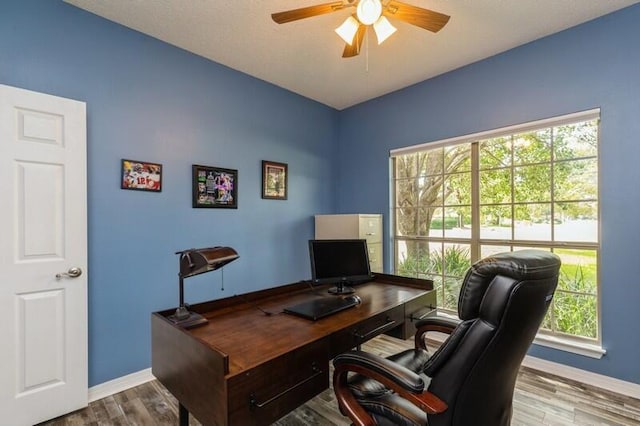 office area with ceiling fan and light wood-type flooring