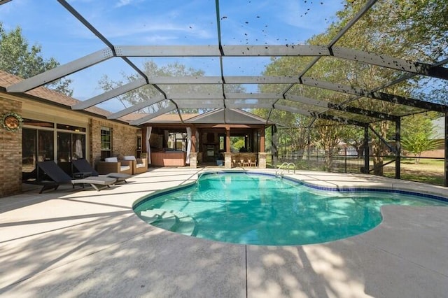 view of swimming pool featuring a lanai and a patio area