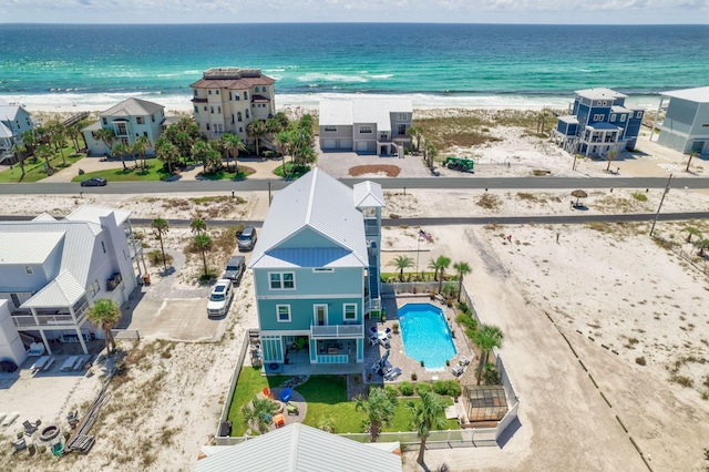 birds eye view of property with a view of the beach and a water view