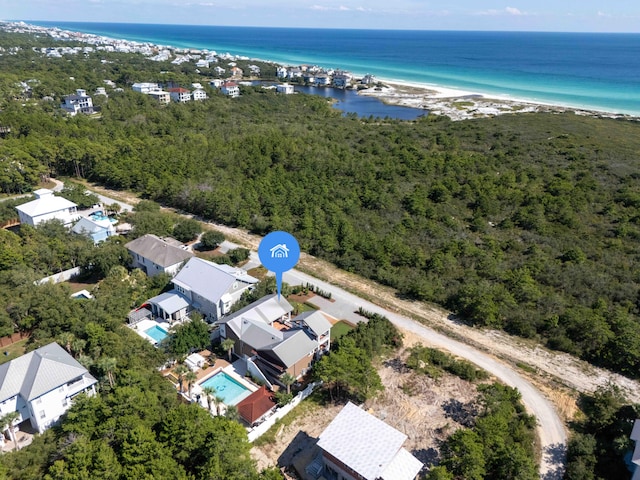 aerial view with a water view and a view of the beach