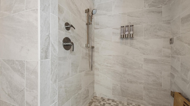 bathroom with tiled shower