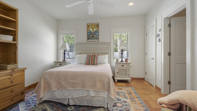 bedroom with recessed lighting, multiple windows, ceiling fan, and baseboards