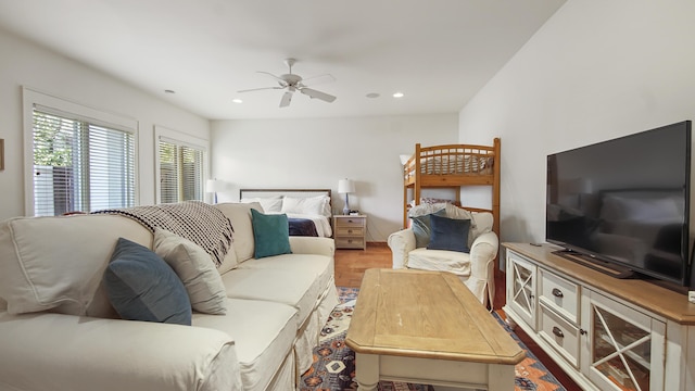 living area featuring a ceiling fan, wood finished floors, and recessed lighting