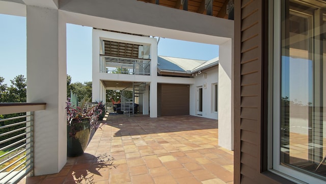 view of patio / terrace with a balcony