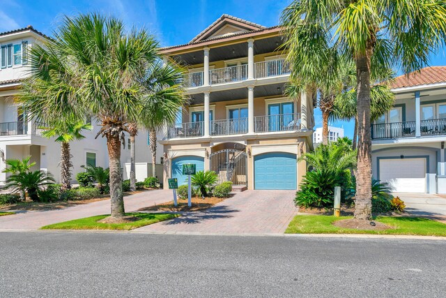 view of front of property with a balcony and a garage