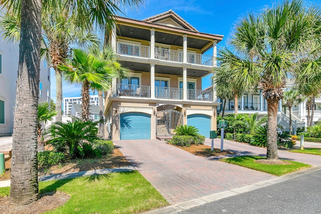 coastal home with a balcony and a garage