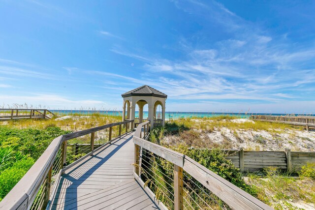 view of property's community featuring a water view and a gazebo