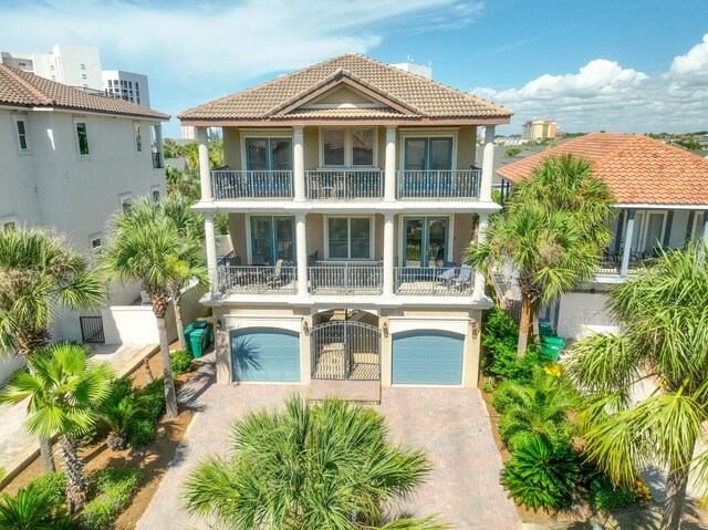 view of front of property with a balcony and a garage