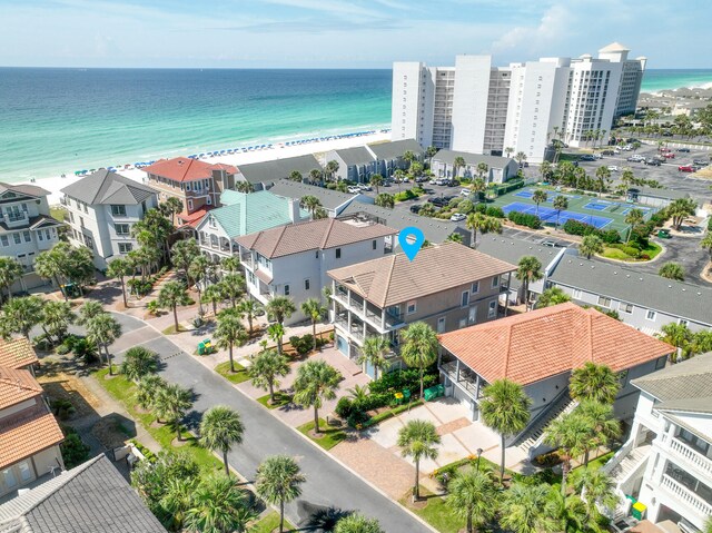 birds eye view of property featuring a view of the beach and a water view