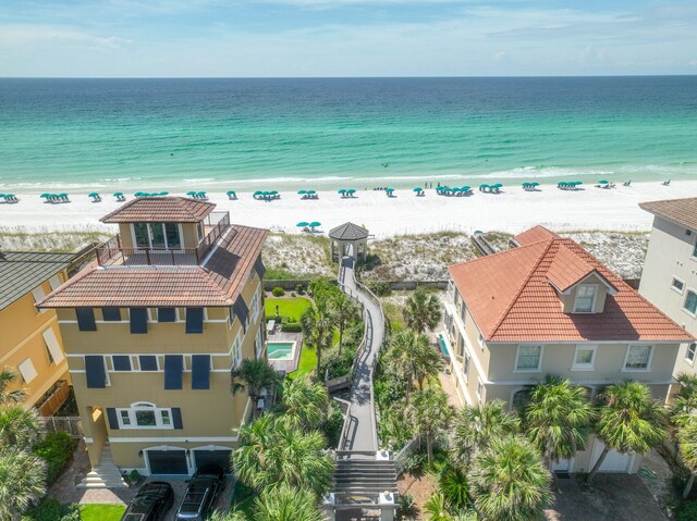 aerial view featuring a view of the beach and a water view