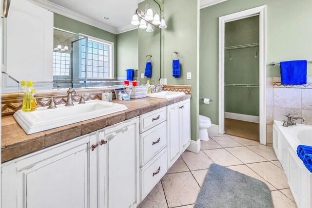 full bathroom featuring vanity, crown molding, toilet, tile patterned floors, and plus walk in shower