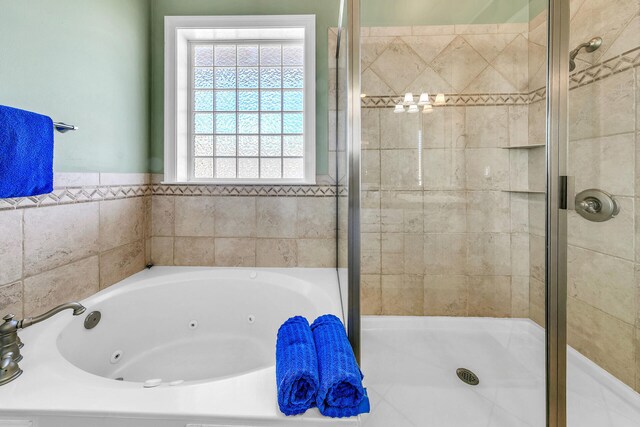 bathroom with shower with separate bathtub