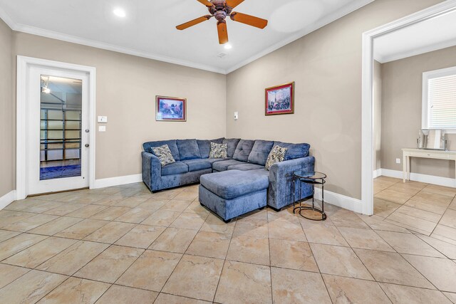 living room with ceiling fan, light tile patterned floors, and ornamental molding