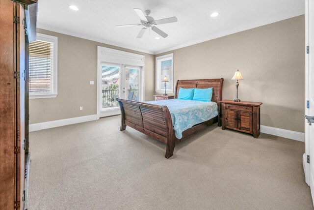 carpeted bedroom with ornamental molding, access to exterior, and ceiling fan