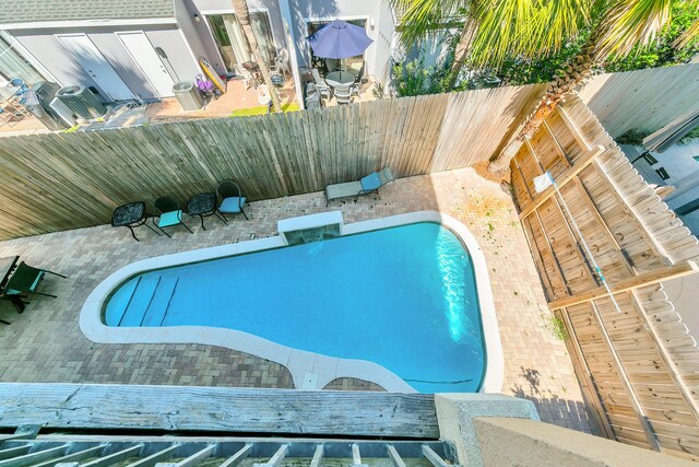 view of pool featuring a patio area