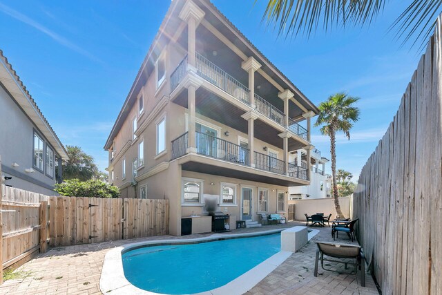 view of pool featuring a patio