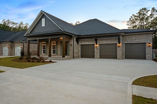 view of front of house featuring covered porch and a garage