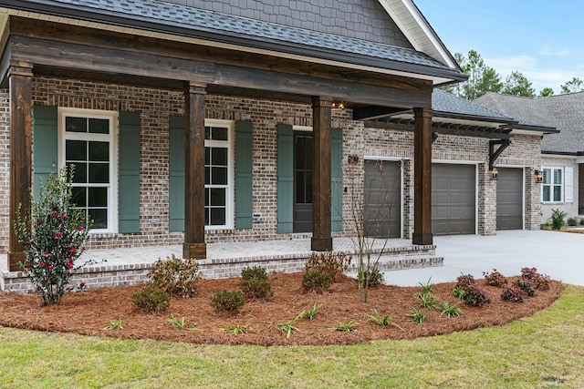 view of front of property featuring a porch and a garage